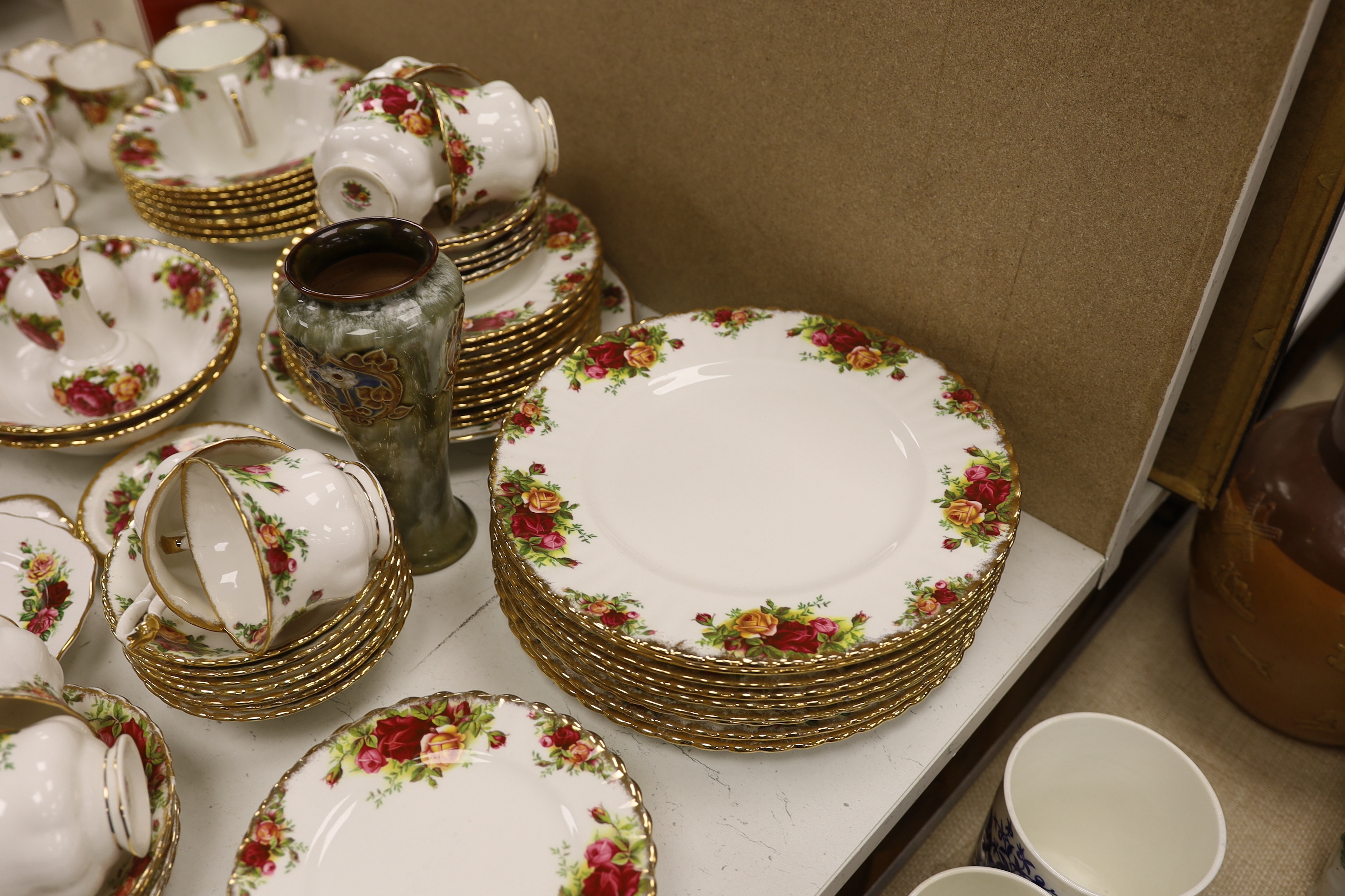 A Royal Albert Old Crown Roses dinner and tea service and a Doulton Lambeth vase